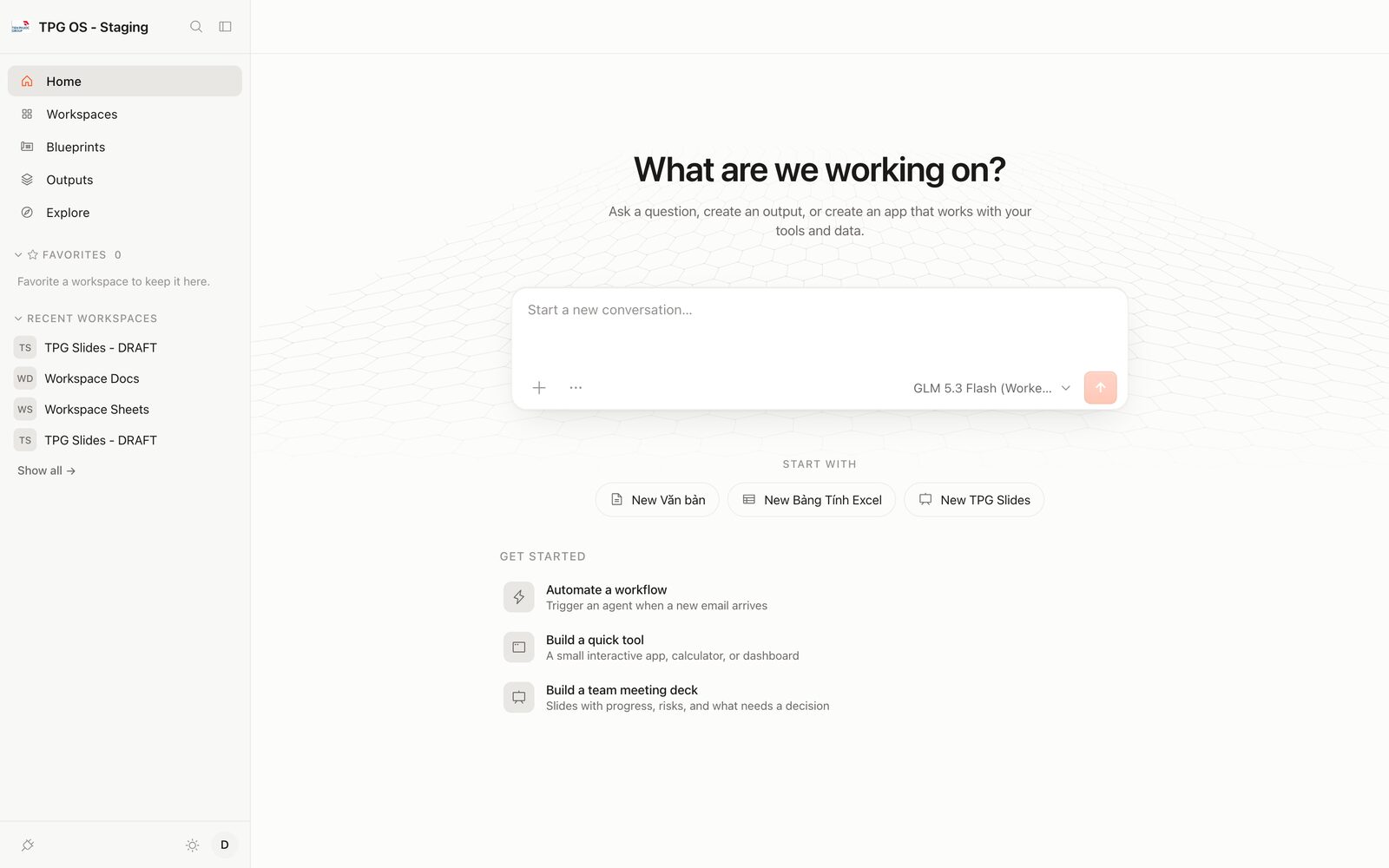 Màn hình chính TPG OS: thanh bên với Home, Workspaces, Blueprints, Outputs, Explore; ô nhập yêu cầu ở giữa; các nút New Văn bản, New Bảng Tính Excel, New TPG Slides